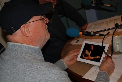 Mick Hanly looking at a photo I took of him in the 80's